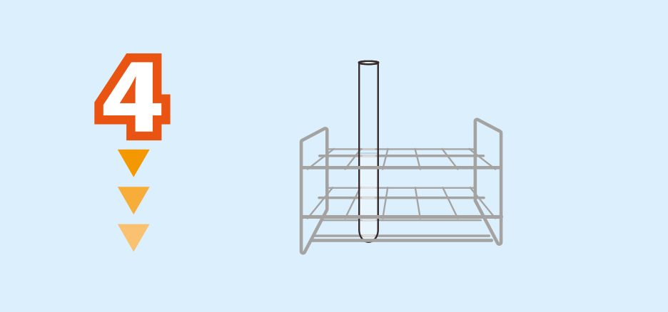 実験方法4: 塩化アンモニウムが全て溶けたら,試験管を試験管立てに立てて放冷する。